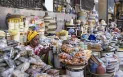 A vendor is seen at a Dakar market in January 2025 in Senegal, which is working to secure a new IMF aid program