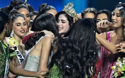 Miss Mexico Fatima Bosch (C) is surrounded by contestants as she celebrates winning the 2025 Miss Universe pageant in Nonthaburi