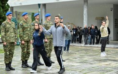 Performers take part in a rehearsal of the lighting of the Olympic flame for the Milan-Cortina 2026 Winter Games