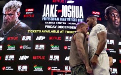 Jake Paul (left) and Anthony Joshua (right) face off at a press conference ahead of their Netflix-backed heavyweight fight next month