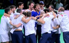 Flavio Cobolli (C) is mobbed by his team-mates after sealing another Davis Cup triumph for Italy