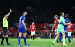 Everton's Idrissa Gueye (second right) is sent off at Old Trafford following an altercation with teammate Michael Keane