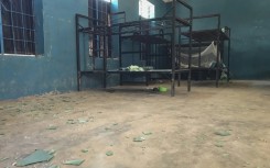 Empty bunk beds, shattered glass and scattered belongings are all that remain in this student dormitory at the school