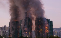 Al least four people were killed when a fire engulfed several high-rise blocks in a residential estate in Hong Kong