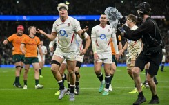 England's Henry Pollock (C) celebrates after scoring a try against Australia at Twickenham