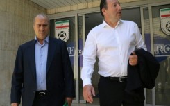 Iranian Football Federation president Mehdi Taj (left)