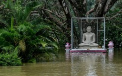 A storm brought heavy rains across all of Sri Lanka, triggering flash floods and deadly landslides that killed at least 390 people