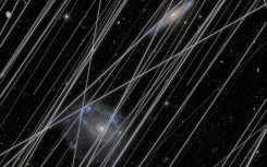 An image simulating how lights from satellites contaminate images of the universe taken by space telescopes