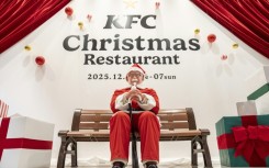 A statue of Colonel Sanders dressed as Santa Claus is displayed at the KFC Christmas restaurant in Tokyo