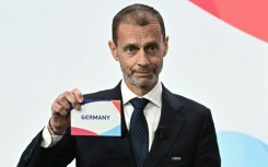 UEFA president Aleksander Ceferin shows the name of Germany, selected as women's 2029 Euros hosts