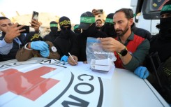 Palestinian militants hand the remains over to the Red Cross which then passes them on to Israeli forces