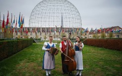 Katja Burgler (L), Maya Stieger (R) and Peter Looser perform in the garden of the UNESCO headquarters in Paris