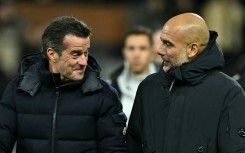 Fulham manager Marco Silva (left) speaks with Manchester City boss Pep Guardiola at Craven Cottage