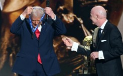 US President Donald Trump receives the FIFA Peace Prize from FIFA chief Gianni Infantino