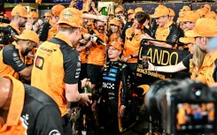 Lando Norris (C) won the title by two points ahead of Max Verstappen