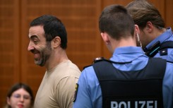 The alleged ringleader, an Armenian national partially identified as Vardges I., is led into the courtroom