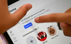 10-year-old Bianca Navarro tries to unlock a social media site after receiving an age verification message at her home in western Sydney