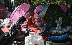 Displaced residents rest at an evacuation center in the Thai border province of Surin during clashes along the Thai-Cambodia border