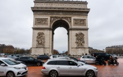 Greenpeace dumped orange paint in front of the Arc de Triomphe on the 10th anniversary of the Paris Agreement
