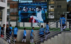 Young footballers head for the pitch at the Mohamed Salah sports complex in Nagrig