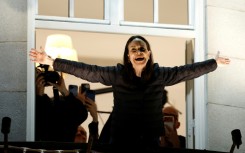 Nobel peace laureate Maria Corina Machado greets supporters from a balcony of the Grand Hotel in Oslo, Norway, early on December 11, 2025