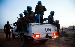 Peacekeeper troops from Ethiopia, deployed as part of the United Nations Interim Security Force for Abyei (UNISFA), patrol in a UN vehicle at night in Abyei town, Abyei state, on December 14, 2016