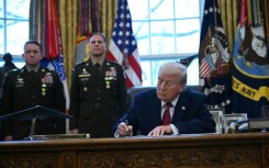 US President Donald Trump signs an executive order on fentanyl in the Oval Office on December 15, 2025