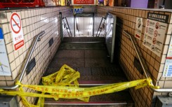 This picture taken and released by Taiwan's Central News Agency (CNA) shows one of the entrances to Taipei Main Station being cordoned off after an attack