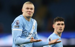 Manchester City striker Erling Haaland (L)