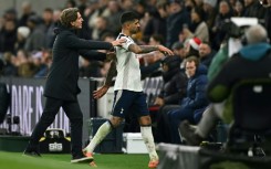Tottenham captain Cristian Romero is ushered off the pitch by head coach Thomas Frank after being sent off in a 2-1 Premier League defeat by Liverpool