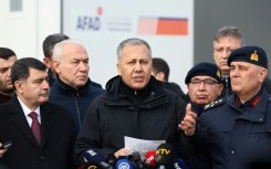 Turkey's Interior Minister Ali Yerlikaya, centre, has announced hundreds of arrests of Islamic State suspects in the past week