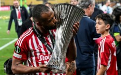 El Kaabi kisses the UEFA Conference League trophy after scoring the winning goal for Olympiacos in the final against Fiorentina in 2024