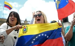 People celebrate in Bogota after US forces captured Venezuelan leader Nicolas Maduro in Caracas