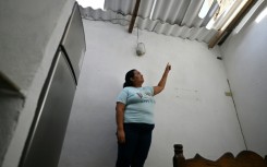 Linda Unamuno burst into sobs as she described US airstrikes on the port city of La Guaira north of Caracas