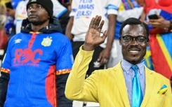 DR Congo supporter Michel Kuka Mboladinga has attracted attention at the Africa Cup of Nations where he has spent entire matches motionless in the stands, adopting a pose in tribute to Congolese independence hero Patrice Lumumba