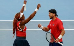 Coco Gauff and Christian Harrison celebrate defeating Greece’s Maria Sakkari and Stefanos Tsitsipas