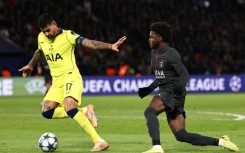 Tottenham defender Cristian Romero (L)