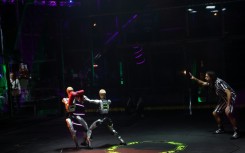 Robots mirroring movements of their human "pilots" exchange punches during the Ultimate Fighting Bots competition on the sidelines of the annual Consumer Electronics Show in Las Vegas