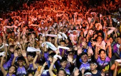 Philippine Catholic devotees wave white towels and handkerchiefs during mass prior to the annual religious procession of the image of Jesus Nazareno, also known as Jesus the Nazarene, in Manila on January 9, 2026