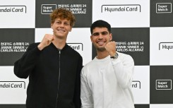 Italy's Jannik Sinner (L) and Spain's Carlos Alcaraz pose for a photo on the eve of their match