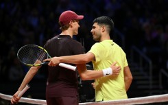 Carlos Alcaraz (R) has Jannik Sinner (L) standing in the way of a first Australian Open title