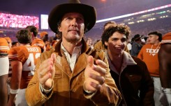 Matthew McConaughey cheers on his beloved Texas Longhorns American football team