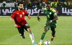 Mohamed Salah (left) and Sadio Mane playing against each other in a World Cup qualifying play-off in March 2022