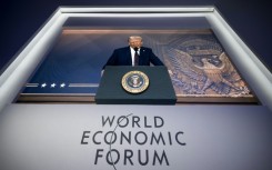 Donald Trump addressing last year's World Economic Forum in Davos via a giant video screen