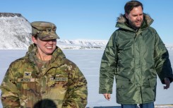 US Vice President JD Vance (R) walks at the Pituffik Space Base during his visit to Greenland in March 2025