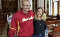 Venezuelan journalist Carlos Julio Rojas (L) is among those released from prison in Venezuela after Nicolas Maduro's ouster