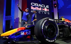 Red Bull drivers Isack Hadjar and Max Verstappen snap a selfie at te unveiling of the team's car for the 2026 Formula One season