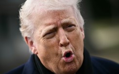 US President Donald Trump speaks to the press before boarding Marine One as he departs from the South Lawn of the White House in Washington