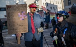 Protesters gather in Davos on Sunday ahead of the opening of the World Economic Forum