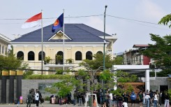 Dozens of people queued up outside the Indonesian embassy in Phnom Penh after they were freed by cyberscam netwoerks